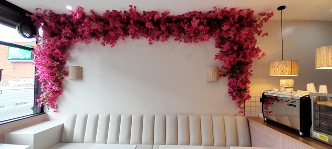 Marble tables and cream banquette seating, alternate view